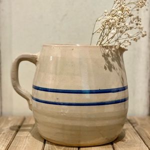 Large vintage crock pitcher with blue stripes